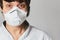 Close up portrait of a Doctor wearing a respirator N95 mask to protect from airborne respiratory diseases such as the flu, coronav