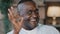 Close-up portrait elder african man positive grandpa ethnic father show consent sign okay hand gesture everything fine