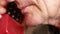 Close up portrait of elderly Caucasian man talking on the phone. Senior man talking on old wired phone. Pensioner answers the call