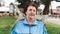 Close up portrait of an elderly smiling woman in a tracksuit. Outdoor. Concept of International Day of Older Persons