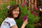 Close up portrait of an English lady and Cosmos flowers.