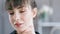 Close-up portrait face of young attractive European woman with dark hair and bangs