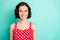 Close up portrait of fascinating young beautiful wonderful lady posing in front of came while isolated with teal