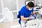 Close-up portrait of a female patient visiting dentist for teeth whitening in clinic. Preparing