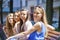 Close-up portrait of four urban women outside