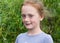 Close up portrait of a ginger smiling girl