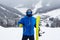 Close up portrait guy holding yellow snowboard in winter