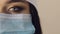 Close up portrait of half female doctor face.