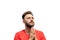 Close up portrait of handsome bearded young man looking up with hope, keeping palms together as praying isolated on white. God