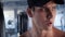 Close-up portrait of handsome male athlete in the gym workout room