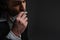 close-up portrait of handsome musician playing harmonica