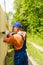 Close up portrait of handy carpenter fixes wooden fence