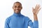 Close-up portrait of happy friendly-looking, handsome african american waving hand in hello or goodbye, say hi to friend