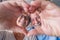 Close up portrait happy sincere middle aged elderly retired family couple making heart gesture with fingers, showing love or