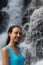 Close up portrait of happy woman at waterfall. Smiling Caucasian woman. Travel lifestyle. Jembong waterfall, Bali, Indonesia