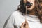 Close up portrait head shot of Young girl wearing fake mustaches - Girl holding funny mustache on stick