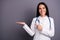 Close-up portrait of her she nice attractive cheery brunet girl holding on palm demonstrating medical meds pill