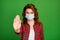 Close-up portrait of her she nice attractive foxy ginger serious wavy-haired girl wearing gauze mask showing palm stop
