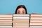 Close-up portrait of her she nice attractive intellectual smart clever brainy stunned girl hiding behind book shelf at