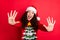 Close-up portrait of her she nice attractive lovely cute cheerful cheery wavy-haired Santa girl giving high five