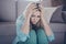 Close-up portrait of her she nice attractive sad miserable sullen depressed girl sitting on floor touching head thinking