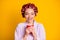 Close-up portrait of her she nice dreamy cheerful woman wearing curlers drinking warm milk isolated over bright yellow