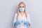Close-up portrait of her she nice professional girl medic anesthetist scientist biologist wearing gauze mask holding in