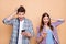 Close-up portrait of his he her she nice attractive charming amazed cheerful cheery glad couple wearing checked shirt