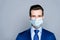 Close-up portrait of his he nice attractive imposing chic classy cheery guy corporate partner wearing medical gauze mask