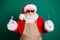 Close-up portrait of his he nice handsome bearded fat overweight Santa grandfather stylist worker wearing apron holding