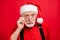 Close-up portrait of his he nice stunned amazed serious wondered bearded Santa Claus omg putting specs off isolated over