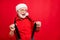 Close-up portrait of his he nice trendy funny cheerful cheery glad bearded Santa pulling suspenders having fun isolated