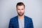 Close-up portrait of his he nice well-groomed serious attractive calm bearded guy wearing checked blazer isolated over