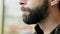 Close-up portrait of hungry bearded man eating ice cream