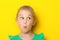 Close-up portrait of a little amazing girl with blue eyes and opening mouth