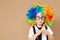 Close-up Portrait of Little boy in clown wig and eyeglasses