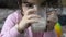 Close-up portrait of little girl drinking a glass of milk