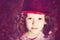 Close up portrait of a little girl in shiny red hat. Instagram f