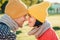 Close up portrait of lovely couple wear warm hats and scarf look with eyes full of happiness and enjoyment, going to have sweet ki