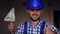 Close-up portrait of a male builder. Plasterer shows thumb up.