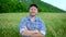 Close up portrait of man farmer with beard looking to the camera in the wheat field. Face of male farmer outdoor,. slow