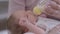 Close-up portrait newborn baby eating milk from bottle lying in female hands. Happy carefree Caucasian child drinking