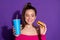 Close-up portrait of nice attractive cheerful girl eating yummy burger drinking cola isolated over bright violet color