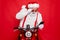 Close-up portrait of nice bearded shocked worried funny funky Santa wearing cap hat sitting on motor bike using cell