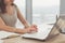 Close-up portrait of an office worker browsing, searching and analyzing new business ideas, surfing the internet at her