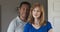 Close up portrait of older African American Husband and Caucasian wife at home