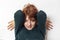 close-up portrait of a pensive teenage girl with red hair with