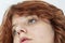 close-up portrait of a pensive teenage girl with red hair with a stylish