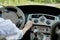 Close up portrait of pleasant looking female with glad positive expression, being satisfied with unforgettable journey by car,