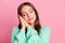 Close up portrait of pretty sleepy person head on hands closed eyes turquoise pullover isolated on pink color background
